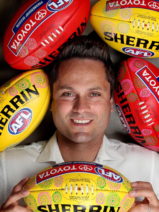 Former AFL player Gavin Wanganeen’s artwork will again grace the Sherrin footballs used during the indigenous round this weekend. Picture: Dylan Coker