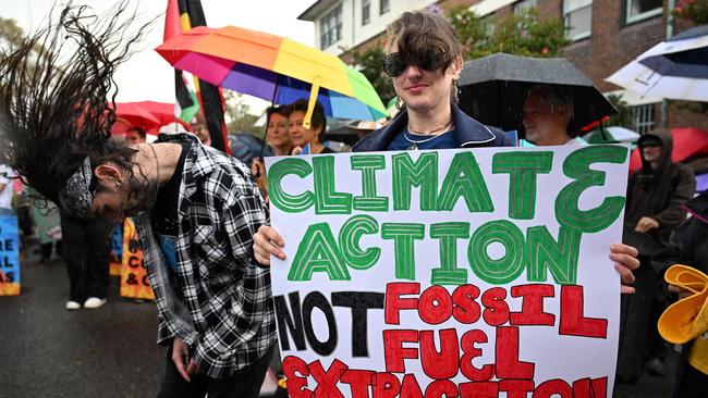 Environmental activists hold a protest rally in front of Kirribilli House, the official residence of the Australian Prime Minister, calling for the Albanese government to halt further approvals of coal and gas projects. Picture: Saeed KHAN / AFP
