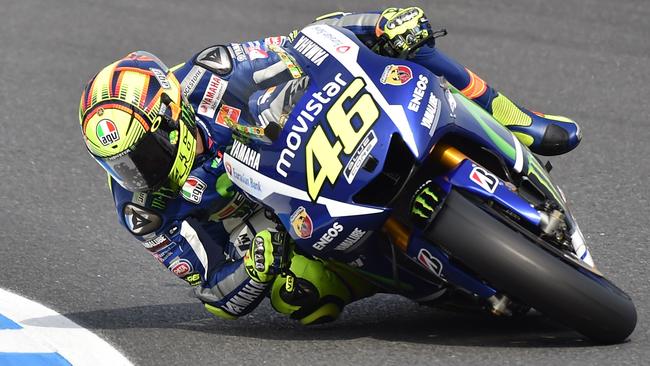 Movistar Yamaha MotoGP rider Valentino Rossi of Italy takes a corner during the third free practice session of the MotoGP Japanese Grand Prix in Motegi, Tochigi prefecture on October 10, 2015. AFP PHOTO / KAZUHIRO NOGI