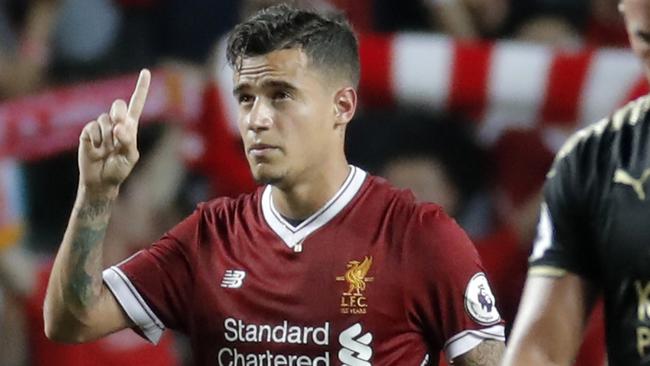 FILE - In this Saturday, July 22, 2017 file photo, Liverpool's Philippe Coutinho celebrates after scoring a goal during the final match against Leicester City FC at the Premier League Asia Trophy soccer tournament in Hong Kong. Liverpoolâ€™s American owners say Philippe Coutinho will not be sold in this transfer window, amid interest in the Brazil playmaker from Barcelona. In a short statement on Friday, Aug. 11, 2017, Fenway Sports Group say Liverpoolâ€™s â€œdefinitive stance is that no offers for Philippe will be considered.â€ (AP Photo/Kin Cheung, file)