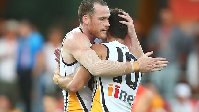 Jarryd Roughead and Jaeger O'Meara celebrates a rare Hawthorn goal.