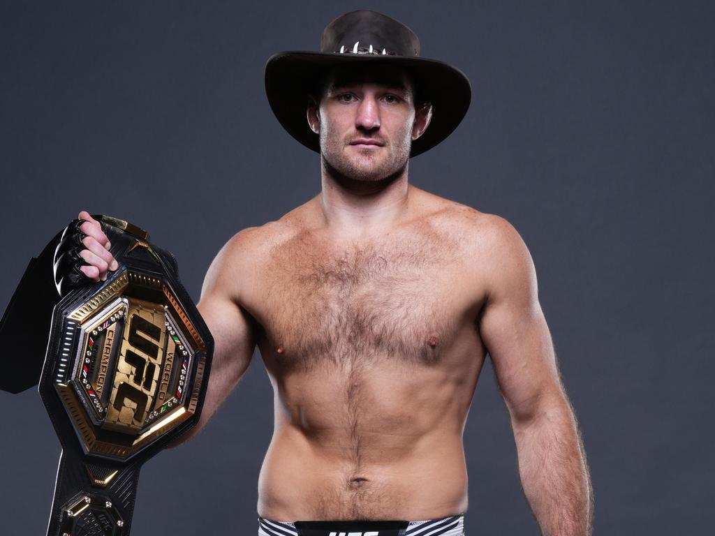 Strickland with the middleweight belt and the Akubra he wore during fight week in Sydney. Picture: Mike Roach/Zuffa LLC via Getty Images