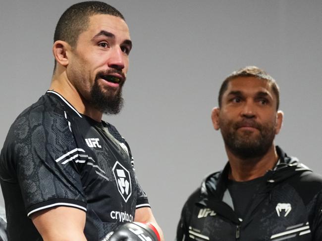 Whittaker (L) and Alex Prates (R) preparing to fight Ikram Aliskerov in June. Picture: Jeff Bottari/Zuffa LLC via Getty Images