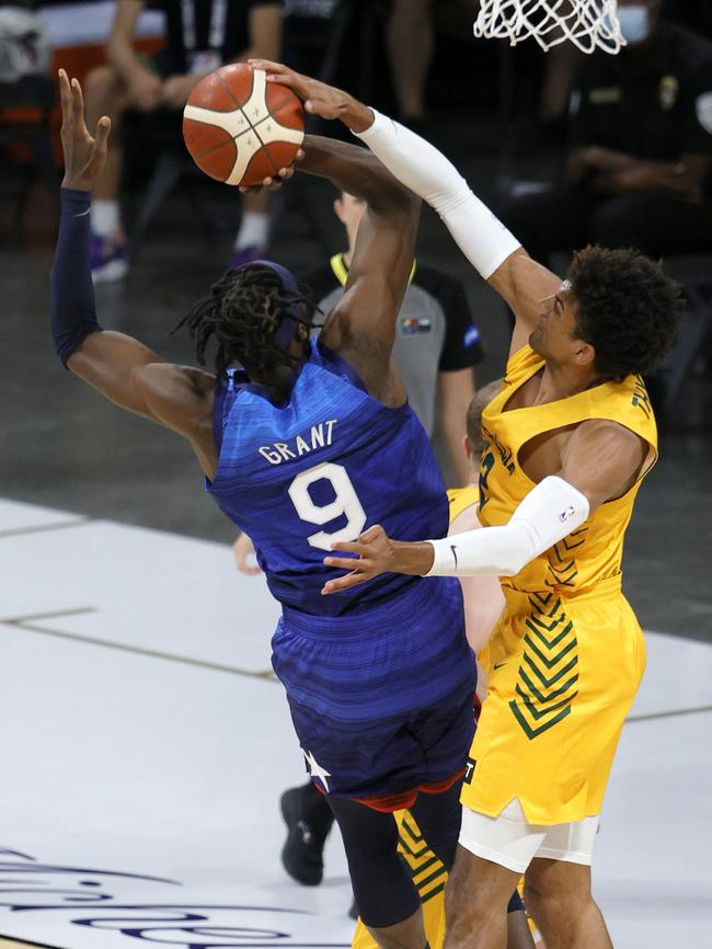 Matisse Thybulle blocks a shot by Jerami Grant. AFP.