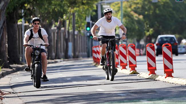 Cyclists on a pop up cycleway on Moore Park Road in Sydney. Picture: Richard Dobson