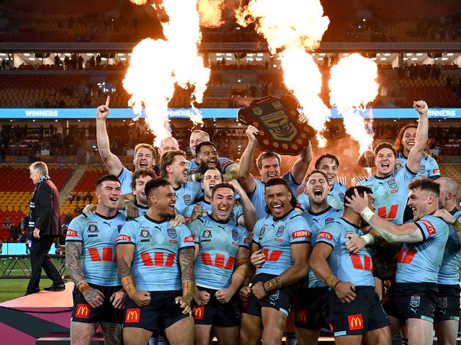 BRISBANE, AUSTRALIA - JULY 17: The New South Wales Blues celebrate victory after game three of the 2024 Men's State of Origin series between Queensland Maroons and New South Wales Blues at Suncorp Stadium on July 17, 2024 in Brisbane, Australia. (Photo by Bradley Kanaris/Getty Images)