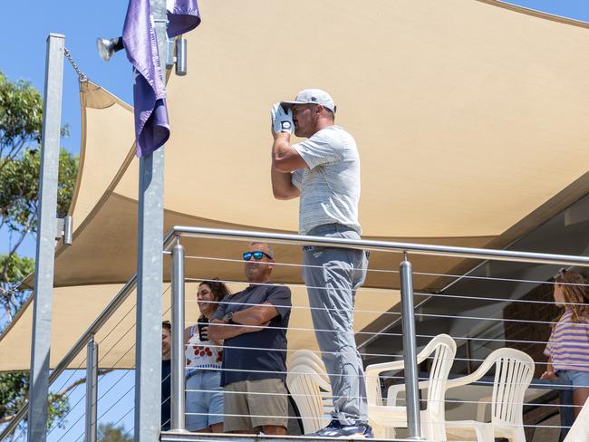 Captain Bryson DeChambeau of Crushers GC reads yardage from a balcony on the 13th hole  during the second round of LIV Golf Adelaide at Grange Golf Club on Saturday, February 15, 2025 in Adelaide, Australia. (Photo by Jon Ferrey/LIV Golf)