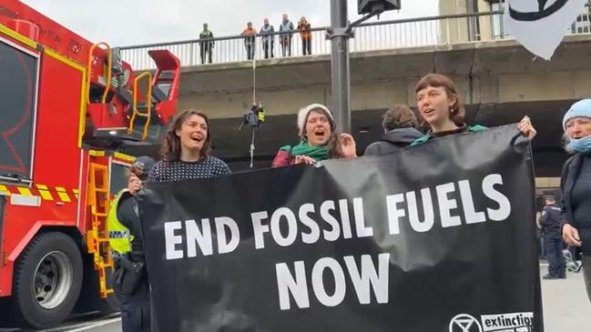 Extinction Rebellion protesters near Morphett Street Bridge this morning. Picture: Facebook