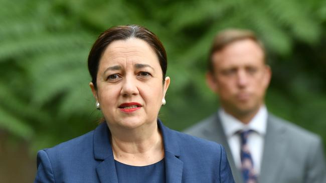 Queensland Premier Annastacia Palaszczuk ((left) and Deputy Premier and Minister for Health and Minister for Ambulance Services, Steven Miles (right) are seen during a press conference at Queensland Parliament House in Brisbane, Wednesday, May 27, 2020. Premier Palaszczuk announced that a 30 year old man from the central Queensland town of Blackwater who died overnight has tested positive to COVID-19.  (AAP Image/Darren England) NO ARCHIVING