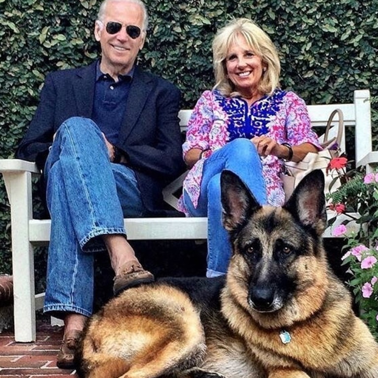 The Bidens with their first dog Champ, who they got as a pup.