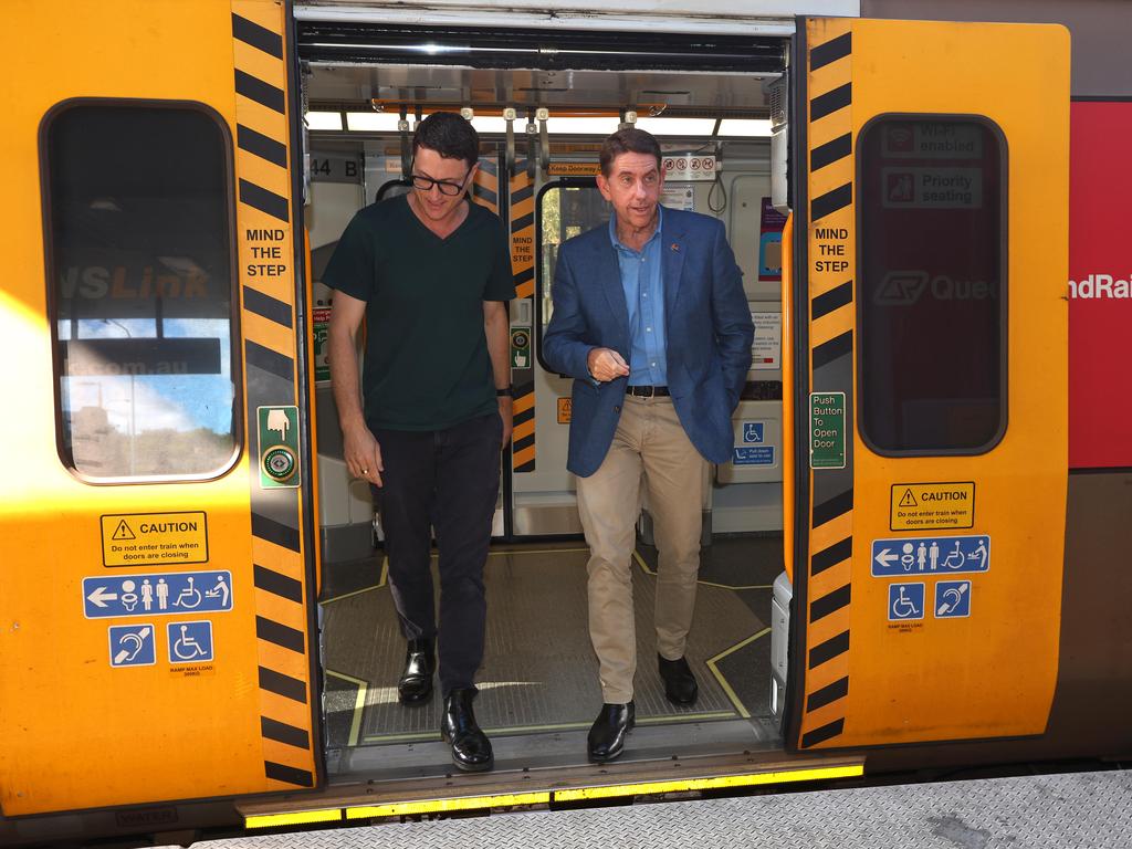 Queensland Deputy Premier and Treasurer Cameron Dick (right) announcing the 50 cent fares. Picture: David Clark