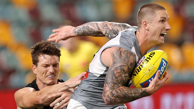 Hamish Hartlett dodges a tackle in Port Adelaide’s win, which clinched top spot.