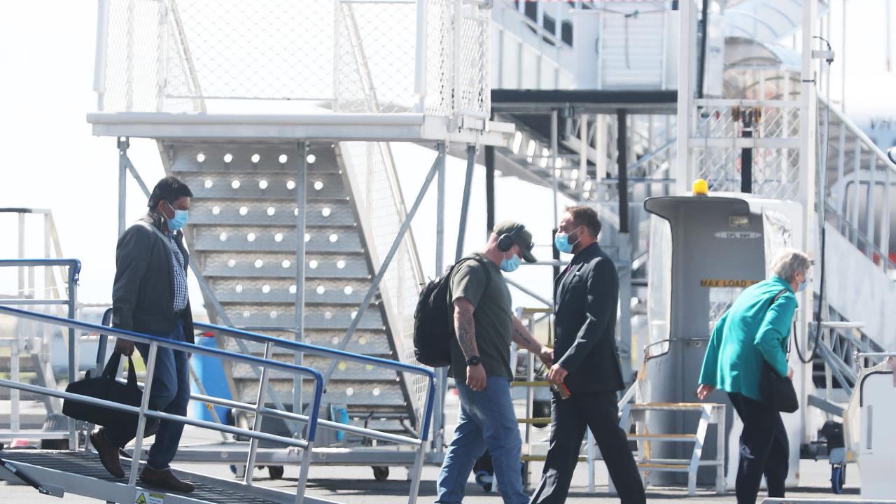 Passengers disembarking off flights. Tasmanian borders open to high risk states once again. Picture: Nikki Davis-Jones