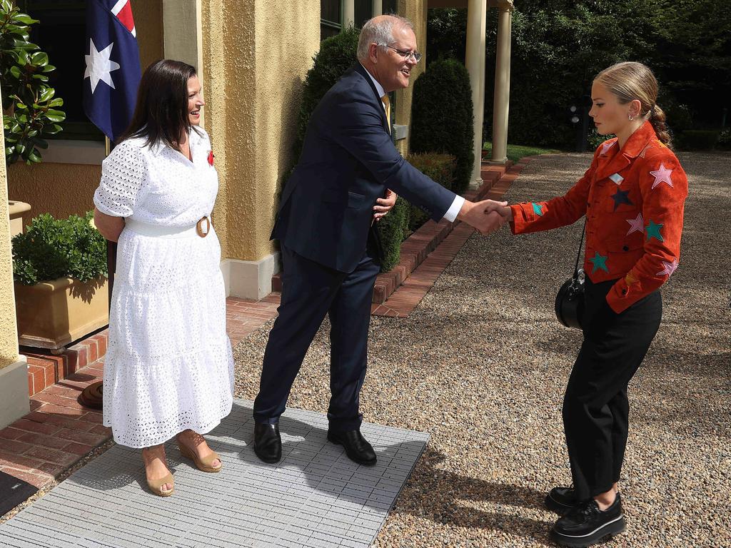 Prime Minister Scott Morrison shakes Grace Tame’s hand. Picture: NCA NewsWire / Gary Ramage