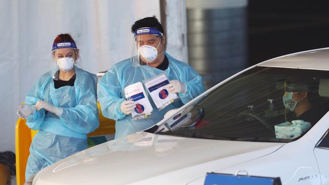 People get tested for COVID-19 at a drive through testing site in Melbourne. Picture: Aaron Francis