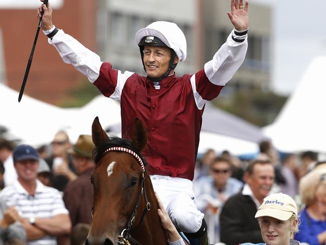 Saluting: Damian Browne on Earthquake after winning the Blue Diamond. Picture: Michael Klein