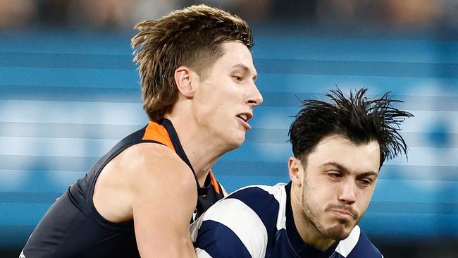 MELBOURNE, AUSTRALIA - JUNE 21: Brad Close of the Cats is tackled by Lachie Fogarty of the Blues during the 2024 AFL Round 15 match between the Carlton Blues and the Geelong Cats at The Melbourne Cricket Ground on June 21, 2024 in Melbourne, Australia. (Photo by Michael Willson/AFL Photos via Getty Images)