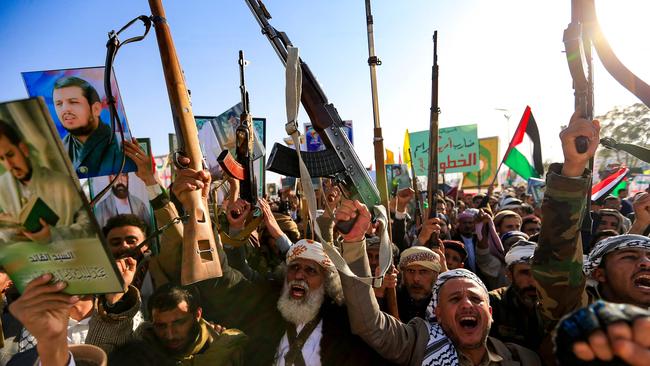 Yemenis brandish rifles and chant slogans during a demonstration denouncing Israeli strikes and solidarity with Palestine in Sana’a. Picture: AFP