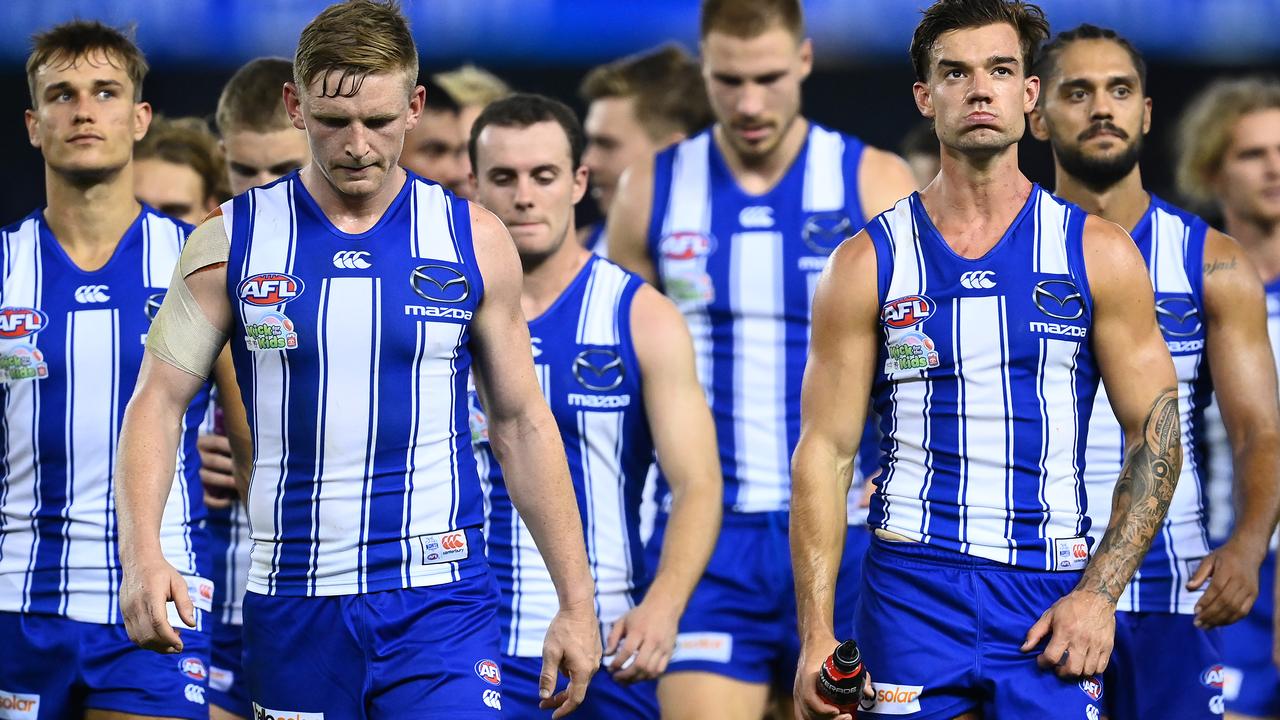 Jack Ziebell and Jy Simpkin lead the Kangaroos off the field after the 128-point loss. Picture: Getty