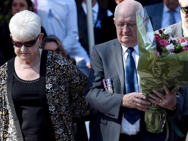 The Eyre family lay a wreath during the memorial service at Prahran police station for the 30th anniversary of the tragic deaths of Constable Steven Tynan and Constable Damien Eyre.  Picture: Nicole Garmston