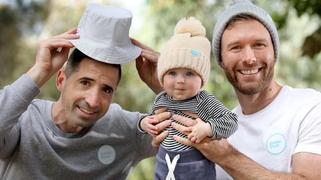 Adelaide entrepreneurs Edward Cooper, left, and Mark Sellar with Mr Sellar’s daughter Olympia wearing a tumbl.bear beanie. Picture Dean Martin