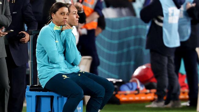 Sam Kerr (L) observes from the sidelines after being ruled out from the Women's World Cup Group B football match between Australia and Ireland due to injury at Stadium Australia.