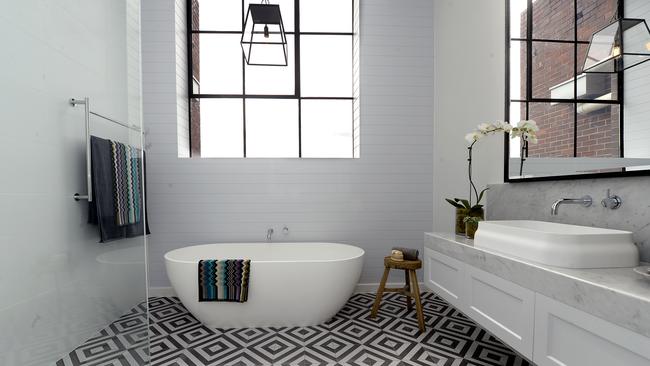 This bathroom from The Block hits the mark with graphic tiles and marble benchtops. Picture: Martin Philbey