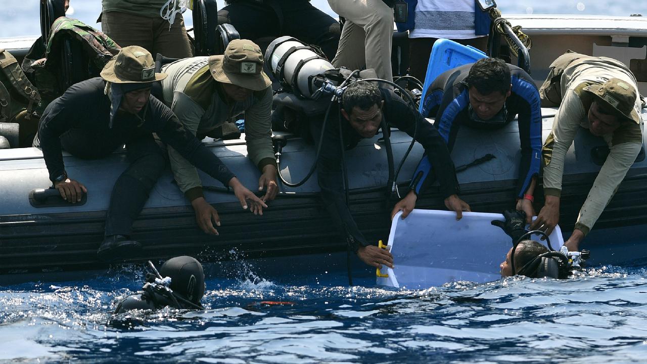 A navy diver recovers the black box from the crash site of the Lion Air plane. Picture: Adek Berry/AFP