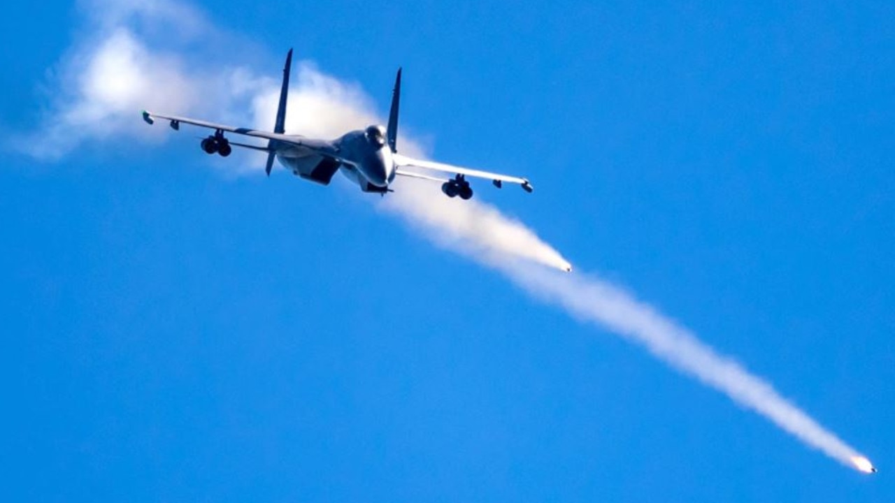 A J-11 strike fighter shoots a rocket during recent live-fire training. Picture: ChinaMil/PLA