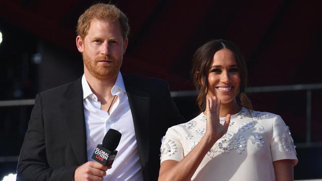 (FILES) In this file photo taken on September 25, 2021, Britain's Prince Harry and Meghan Markle, Duchess of Sussex, speak during the 2021 Global Citizen Live festival at the Great Lawn, Central Park in New York City. - Prince Harry will release his memoir in January, his publisher said Thursday, with the highly-anticipated account of life in the monarchy and after he quit royal duties landing just four months after the death of Queen Elizabeth II. (Photo by Angela Weiss / AFP)