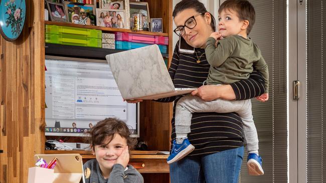 Diana Jeffery juggles a full time job, home schooling her daughter Olivia, 5 and looking after her son Angus, 2, after day car centres were closed due to Lockdown 2.0. Picture: Jake Nowakowski