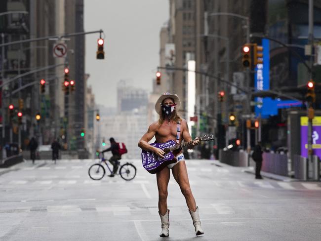 A street performer practises social distancing in New York. Picture: AP