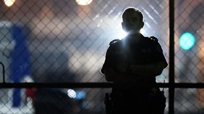 A police officer outside the Buff Club where a man was shot dead. Picture: Keri Megelus