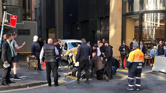 Members of the public restrain Mert Nay in Sydney’s CBD. Picture: AAP