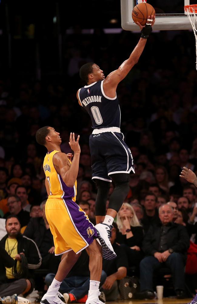 Russell Westbrook of the Oklahoma City Thunder shoots over Wesley Johnson of the Los Angeles Lakers.