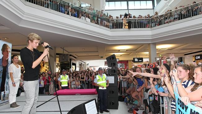  Pop star Cody Simpson performs to thousands of screaming fans at Pacific Fair. 