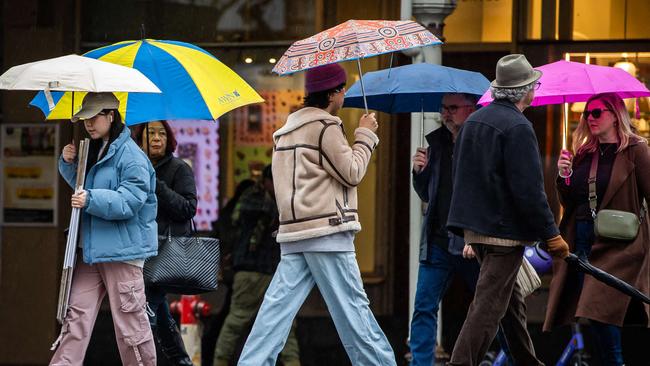 Wet weather photos:  People on the streets in the city of Adelaide with umbrellas to shettler from the rain, on June 29th, 2024.Picture: Tom Huntley