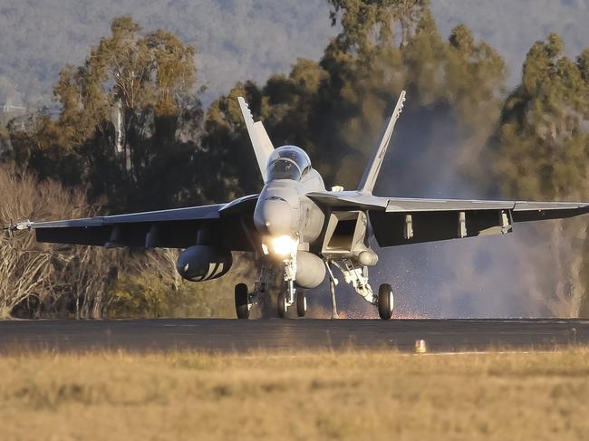 A Royal Australian Air Force F/A-18F Super Hornet aircraft lands while engaging the aircraft arrestor cable at RAAF Base Amberley, Queensland. *** Local Caption *** Air Forceâs aircraft arrestor systems are lifesaving devices utilised in fast jets to preserve the life of the pilot and aircraft in the event of an emergency. Once a fast jetâs hook engages the cable, the arrestor systemâs brakes rapidly decelerate the fast jet as it travels along the runway. Serviced every morning by Combat Support Groupâs Mechanical Equipment Operations and Maintenance Sections at RAAF Bases Amberley, Williamtown, Richmond, Edinburgh, Pearce, Darwin and Townsville, the systems are always ready to go whenever Air Forceâs fast jets are in the air.