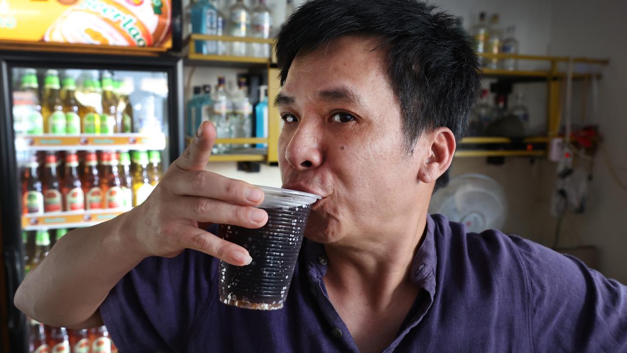 Nana Backpackers Hostel bar tender Toan Van Vanng pours in the same vodka and Coke drink the girls had and drinks it.