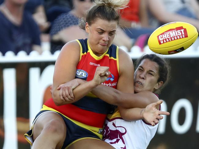 Ebony Marinoff is tackled by Lion Ally Anderson. Picture: Sarah Reed