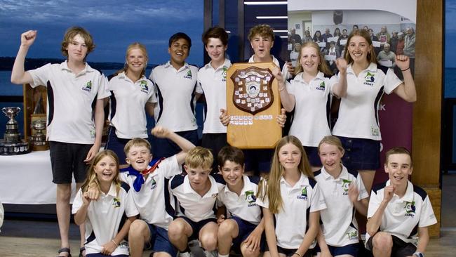 Junior sailors from Sandy Bay Sailing Club with the Tillett Trophy they won the International Cadet Australian Championships. Back row (Left to right): Isaac Archer, Sarah Reynolds, Alex Ashbolt, Henry McQuillen, Sam Hooper, Olive Hooper, Felicity Yarrow Front row (Left to right): Harriet Hogan, George Shugg, Hunter Hogan, Archie McQuillen, Abi Smith, Samantha Archer, Lachie Prior. Picture: Sandy Bay Sailing Club