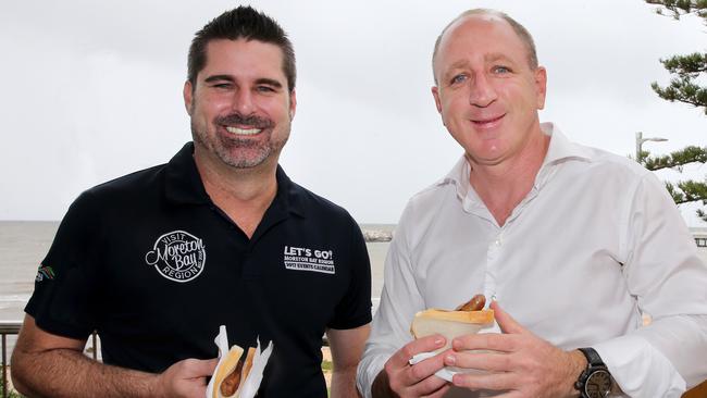 Shane Newcombe and Luke Howarth at a sausage sizzle on Youth Homelessness Matters Day. Picture: Chris Higgins