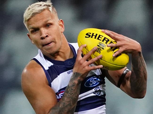 Quinton Narkle of the Cats runs with the ball during the Round 2 AFL match between the Geelong Cats and the Hawthorn Hawks at GMHBA Stadium in Geelong, Friday, June 12, 2020. (AAP Image/Scott Barbour) NO ARCHIVING, EDITORIAL USE ONLY