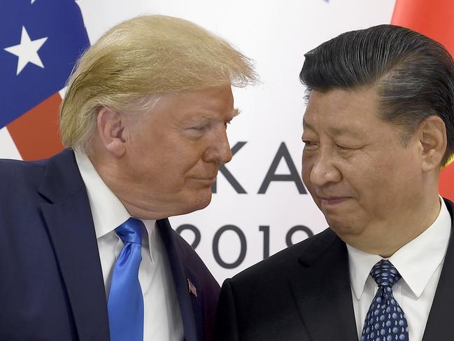 FILE - U.S. President Donald Trump, left, meets with Chinese President Xi Jinping during a meeting on the sidelines of the G-20 summit in Osaka, Japan,  June 29, 2019. (AP Photo/Susan Walsh, File)