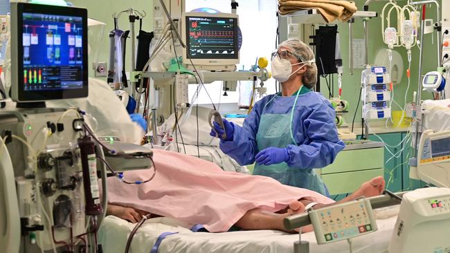 A health worker with a patient in the COVID-19 intensive care unit of the Bolognini hospital in Seriate, Bergamo, in Italy. Picture: AFP