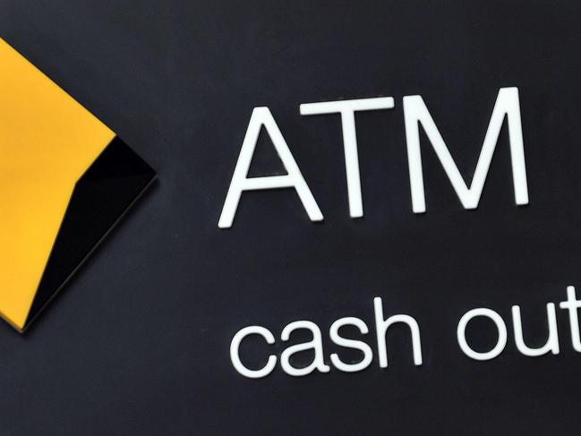 The logo of Australia's Commonwealth Bank is seen outside a branch in the central business district of Sydney on August 12, 2020. - Australia's Commonwealth Bank (CBA) reported an 11.3-percent drop in full-year cash profits as it took provisions against loan losses due to the COVID-19 coronavirus crisis. (Photo by Saeed KHAN / AFP)