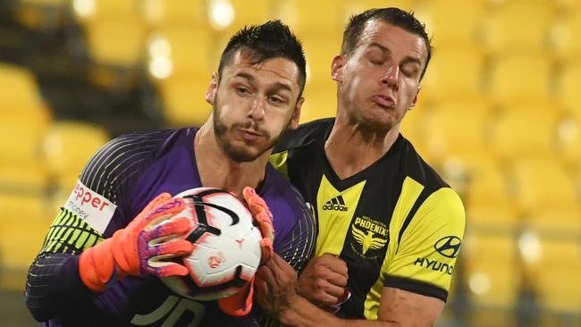 Western Sydney Wanderers goalkeeper Vedran Janjetovic (left) and Wellington Phoenix defender Steven Taylor collide. Picture: AAP