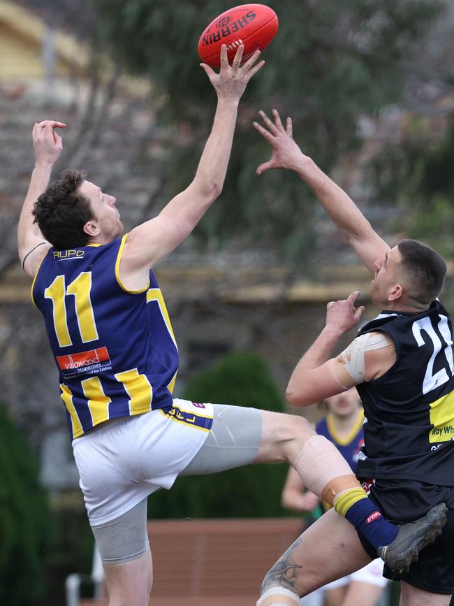 EDFL: Jorden Braddy of Rupertswood wins the tap over West Coburgs’s Dominic Spagnolo. Picture: Hamish Blair