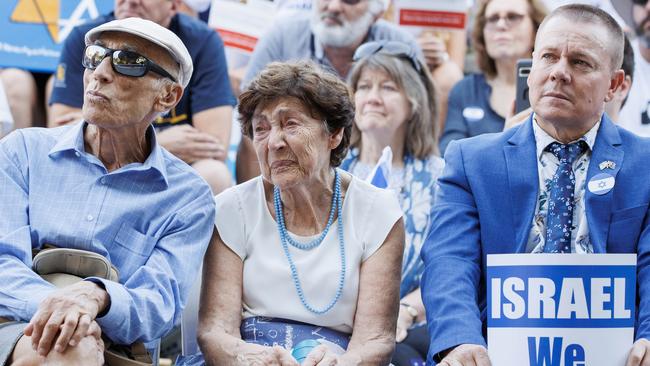 A woman in the crowd weeps for her country as Brisbane’s Jewish community holds a peaceful gathering in the Roma Street Parkland in support of Israel. Picture: Lachie Millard