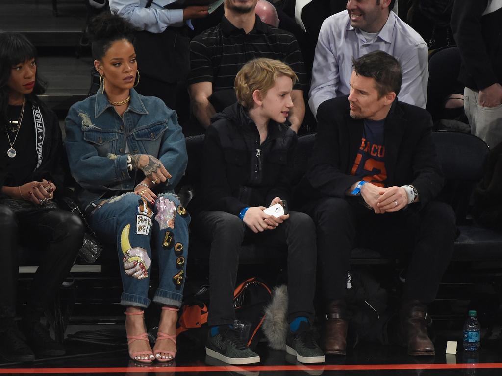 Rihanna, Levon Hawke and Ethan Hawke at an NBA All-Star Game in 2015. Picture: Kevin Mazur/WireImage